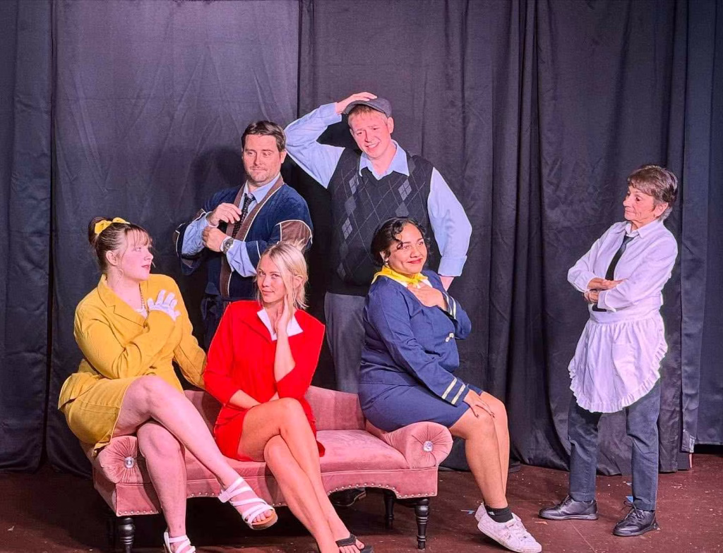 Cast posing after comedy play performance on stage during Nashville in April.