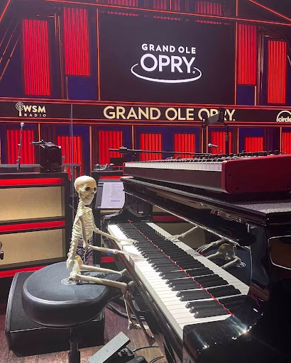 A skeleton figure sits at a piano on the Grand Ole Opry stage, adding a touch of spooky fun to Nashville in November.