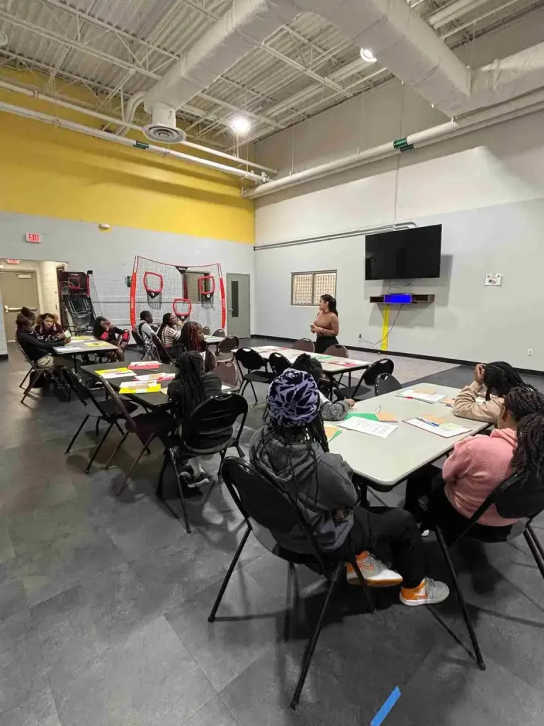 Children sitting in a circle for a free community craft session, one of many Free Summer Activities To Do in Nashville