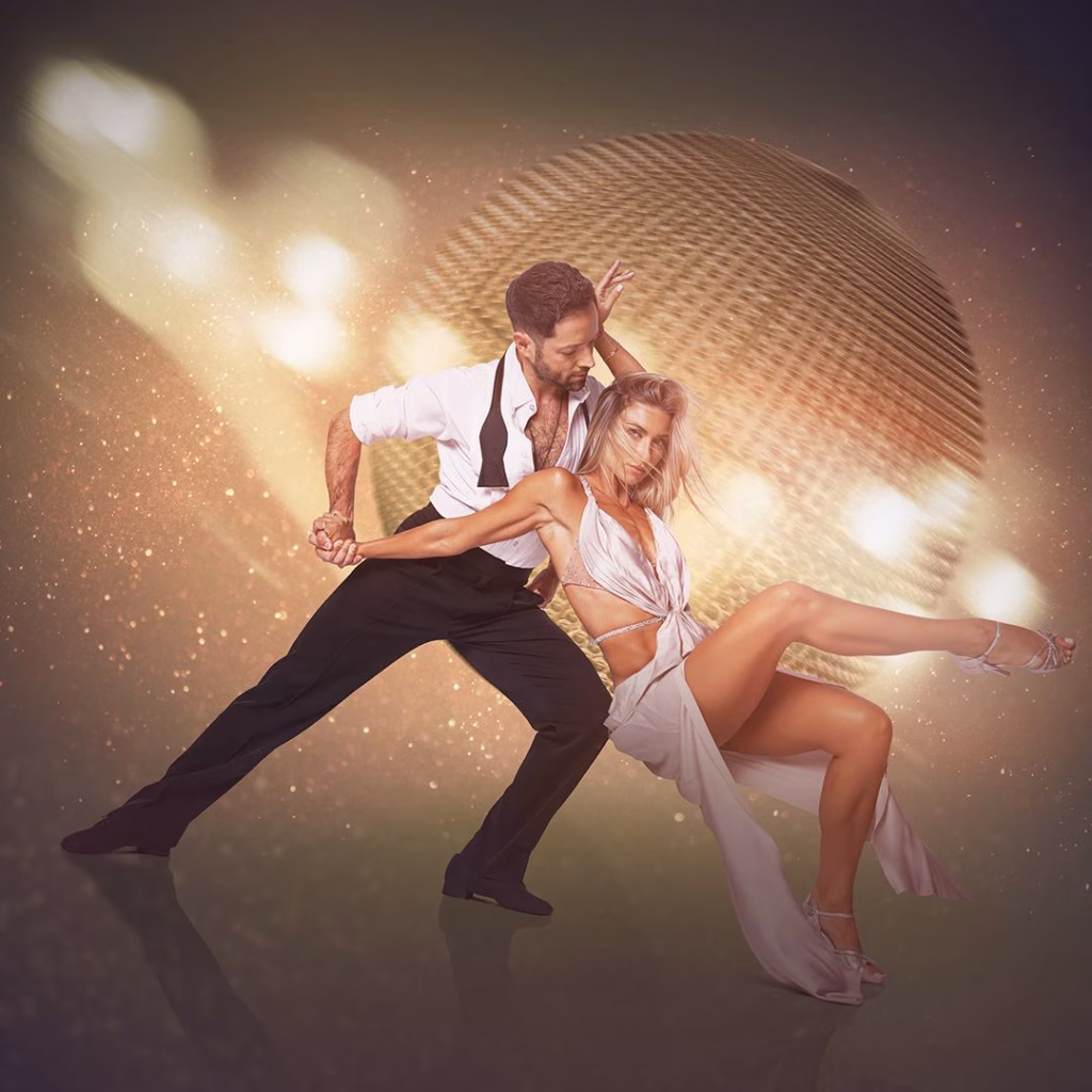 Elegant dancers performing a passionate ballroom routine under golden lights in Nashville in March.