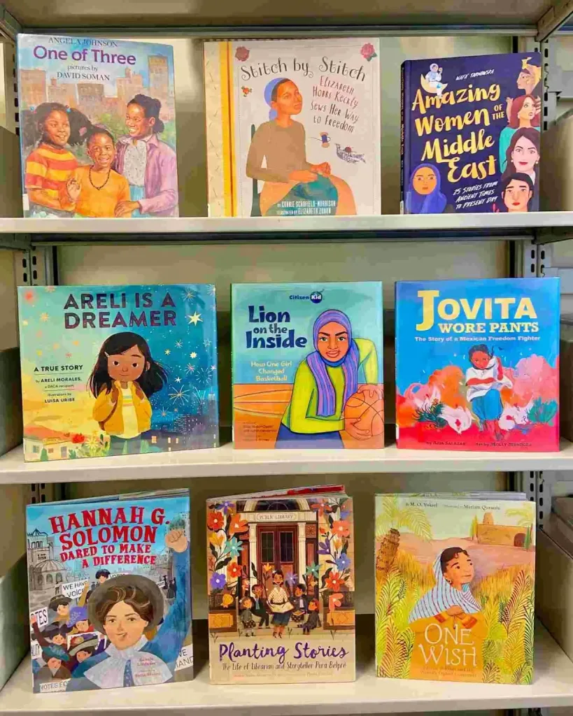Diverse children's book covers are displayed on shelves at the downtown Nashville public library