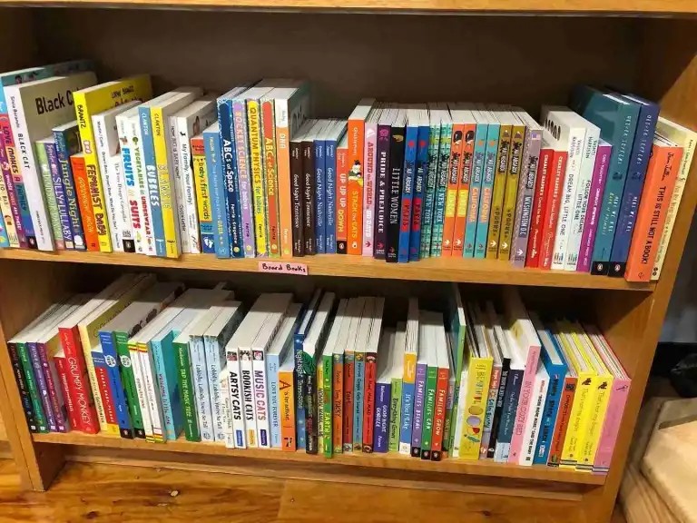 Two shelves packed with colorful board books for young readers at Fairytales Bookstore Nashville
