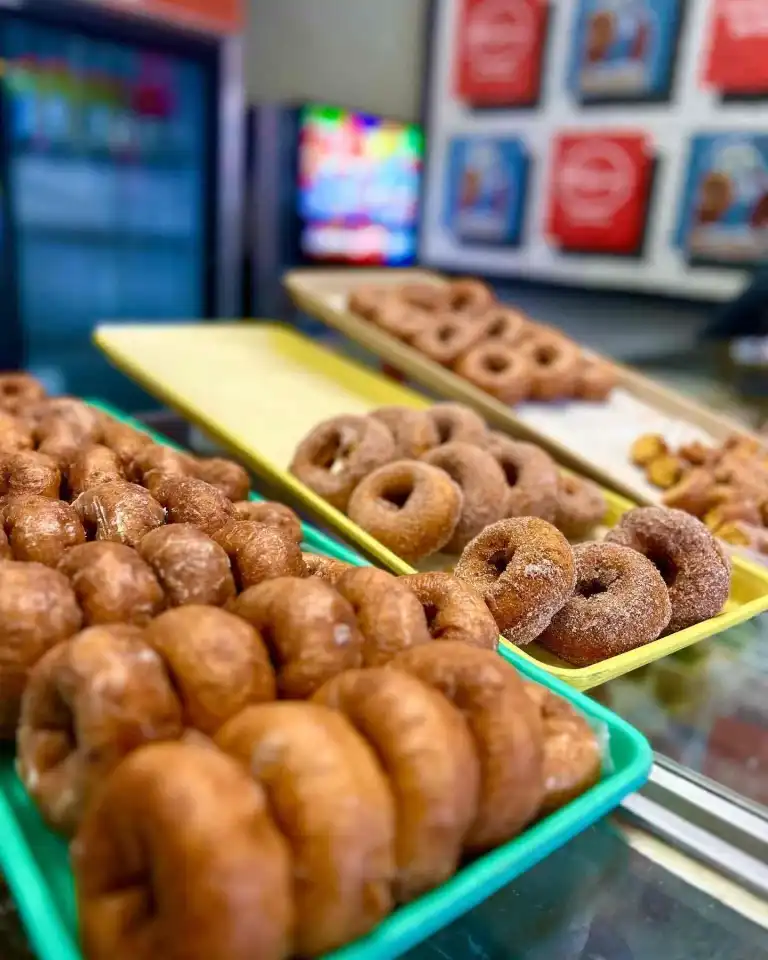Trays of fresh glazed and cinnamon-sugar donuts ready for customers at Fox's Donut Den Nashville.