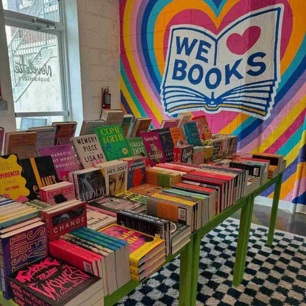 The "We Books" mural and front display table highlights one of the Best Bookstores in Nashville