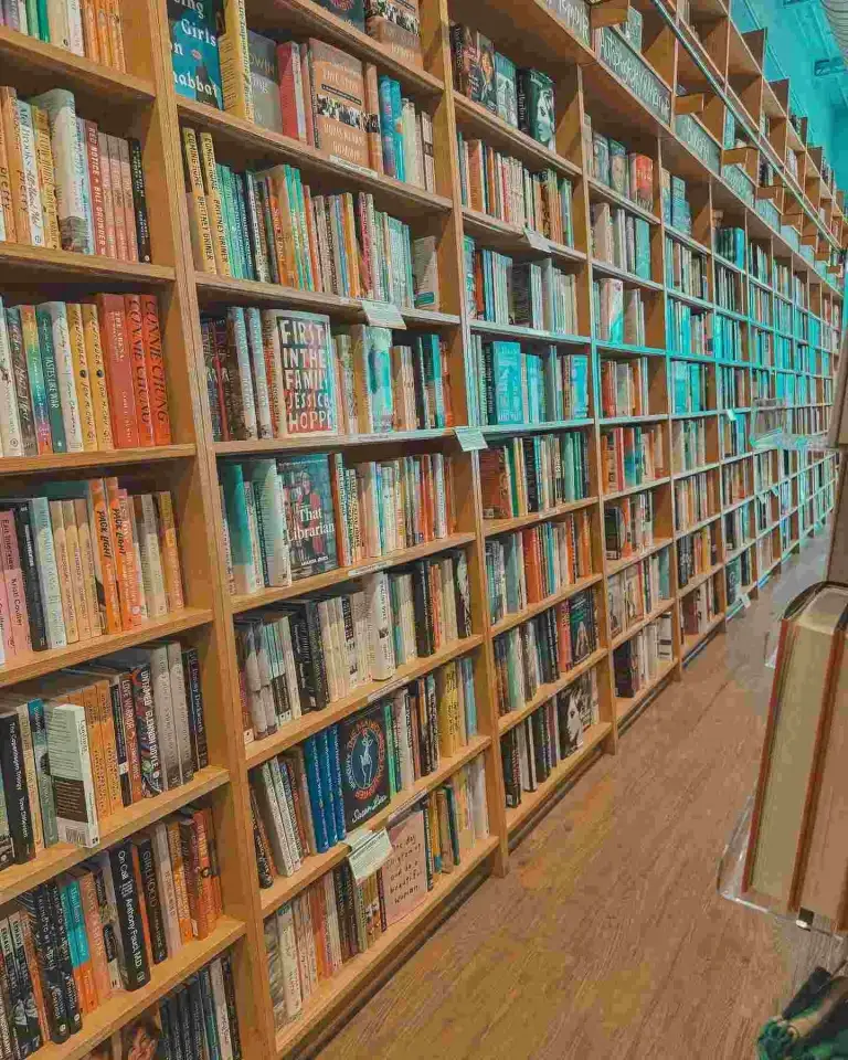 Long aisles of tall, well-stocked bookshelves stretch toward the back of Parnassus Books Nashville