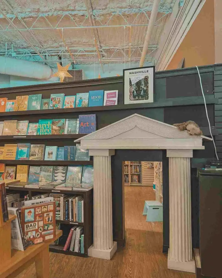 A miniature columned archway and fully stocked bookshelves at Parnassus Books Nashville