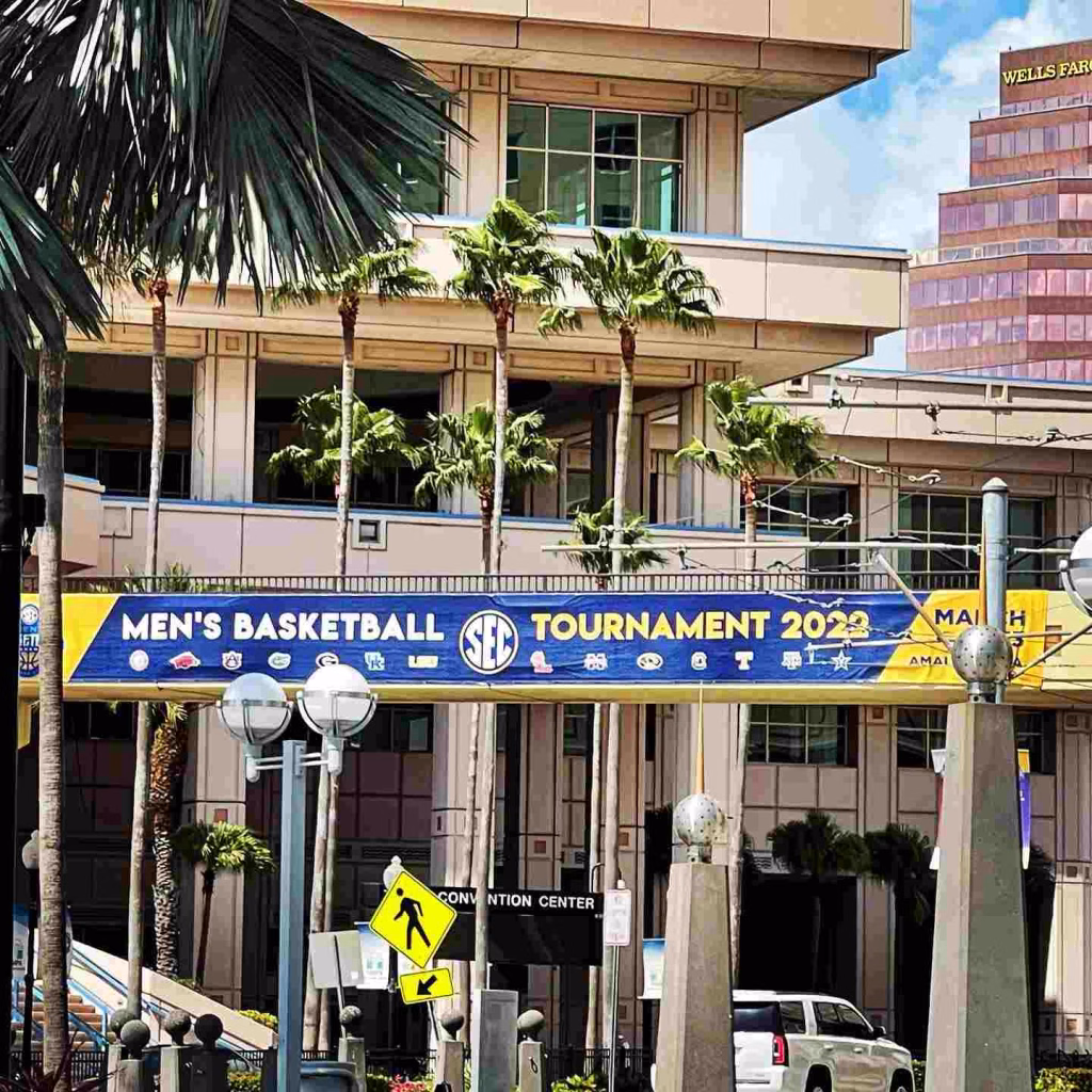 SEC Men’s Basketball Tournament banner displayed outside a convention center in lively Nashville in March.