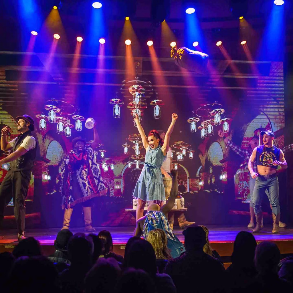Colorful stage performers entertain a lively audience during Shiners Nashville show, dazzling crowds in Nashville in January.