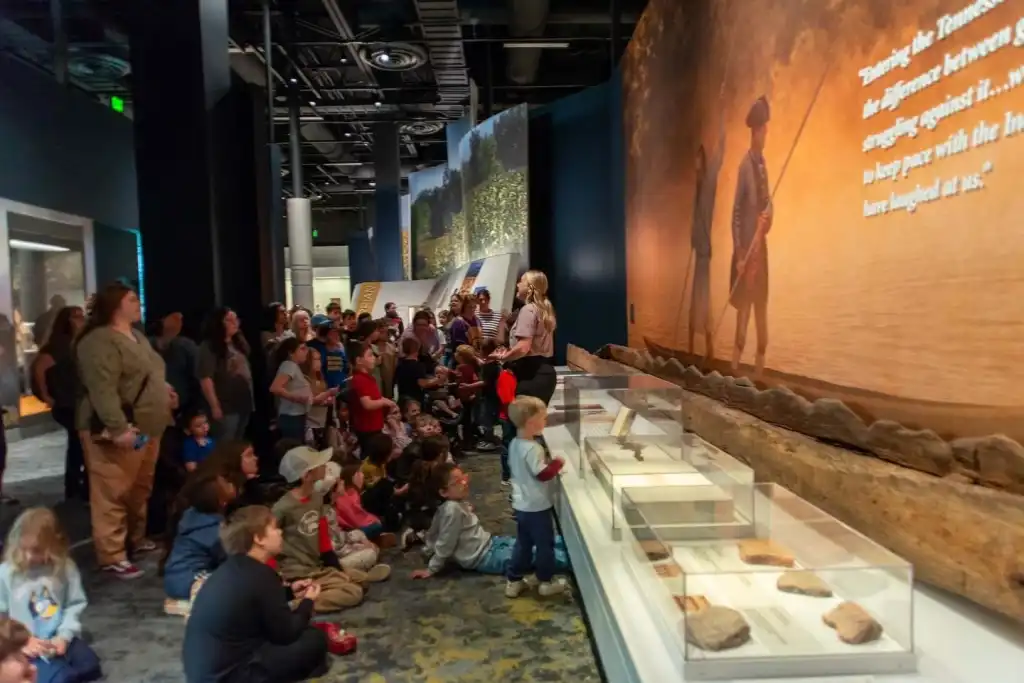 Children sitting on the floor attend a storytime in the children's gallery at Tennessee State Museum Nashville.