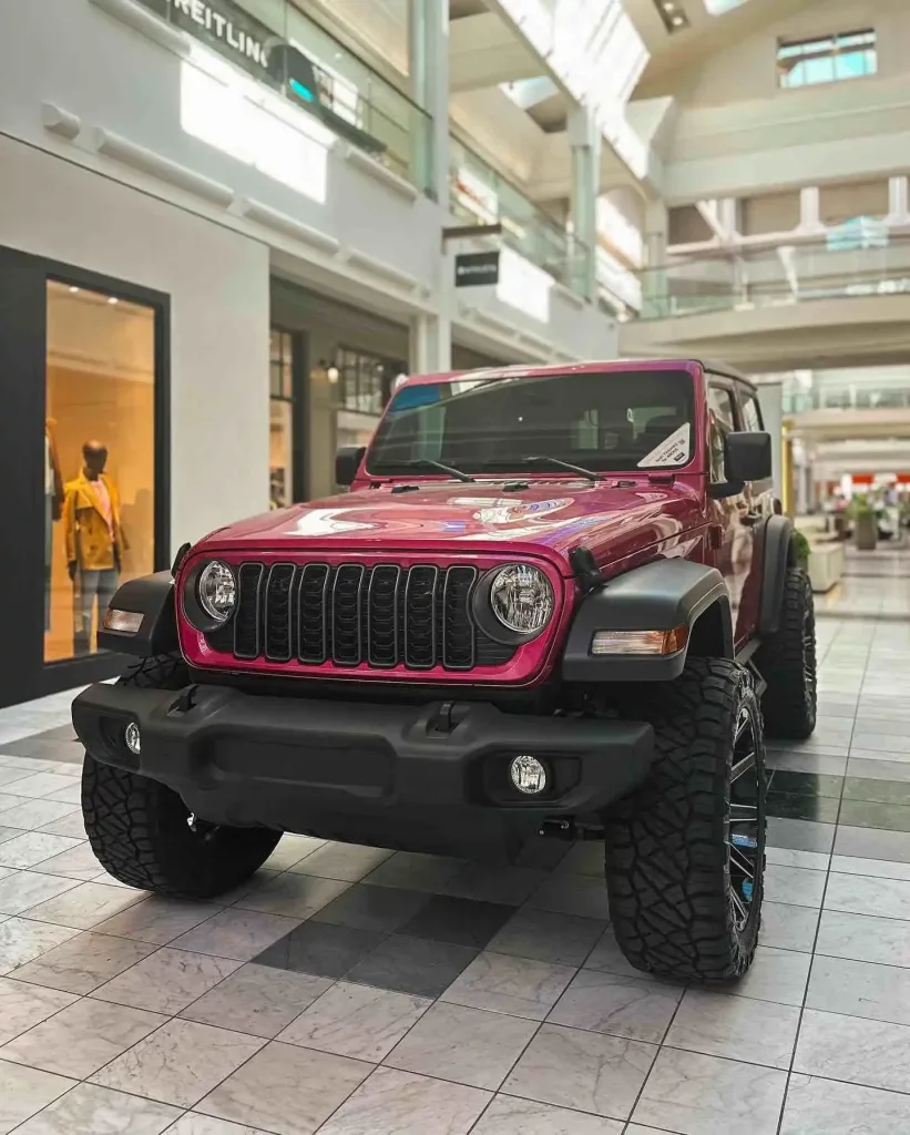 A shiny pink lifted Jeep on display inside the luxury common area of the Mall at Green Hills Nashville Guide