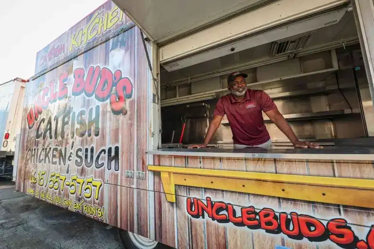 The owner of a "Catfish, Chicken, and Such" food truck, often found at Spicy Boys Nashville