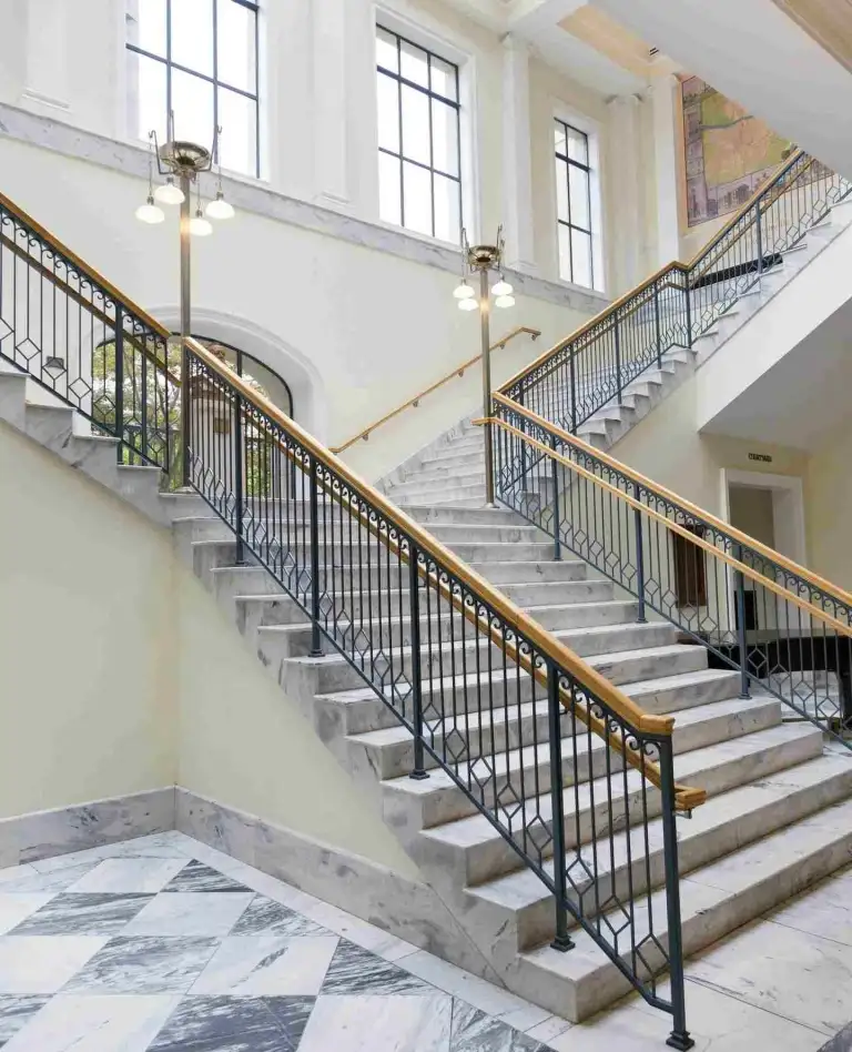 The grand marble staircase and large windows inside the downtown Nashville public library